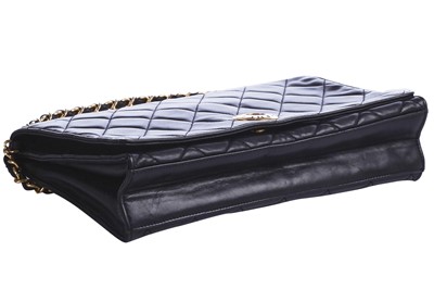 Lot 7 - A Chanel quilted black leather flap bag, 1980s