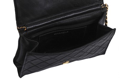 Lot 7 - A Chanel quilted black leather flap bag, 1980s