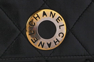 Lot 7 - A Chanel quilted black leather flap bag, 1980s