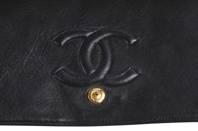 Lot 7 - A Chanel quilted black leather flap bag, 1980s