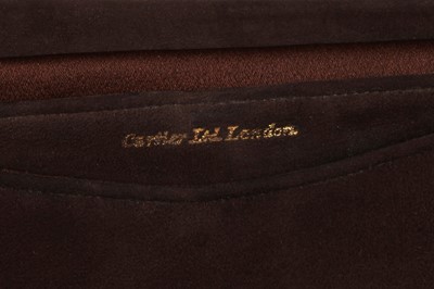 Lot 66 - A Cartier brown suede clutch with 9K gold clasp, 1930s
