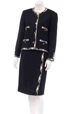 Lot 9 - A Chanel black tweed suit, 1980s
