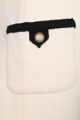 Lot 11 - A Chanel cream and black wool dress, 2005,...