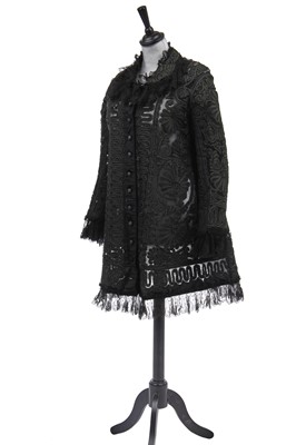 Lot 511 - A coat of bottle-green soutache braid, 1910s