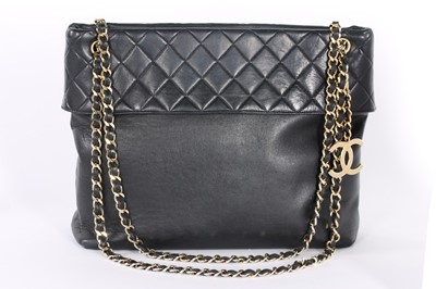 Lot 14 - A Chanel navy lambskin leather shopper, 1980s,...