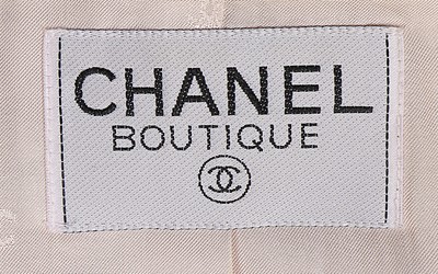 Lot 14 - A Chanel cream wool dress and matching jacket,...