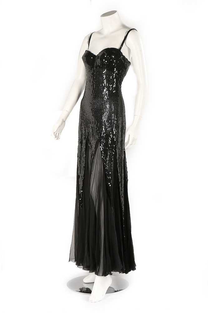 Lot 141 - A Loris Azzaro black sequinned evening gown,...