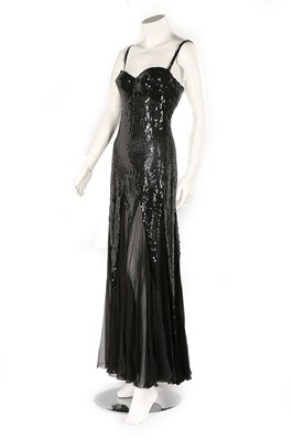 Lot 141 - A Loris Azzaro black sequinned evening gown,...
