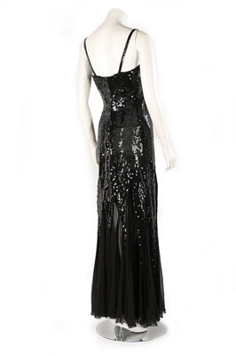 Lot 141 - A Loris Azzaro black sequinned evening gown,...