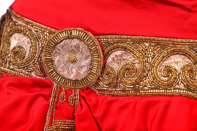 Lot 25 - A red satin cocktail dress in the style of Chanel, probably late 1980s
