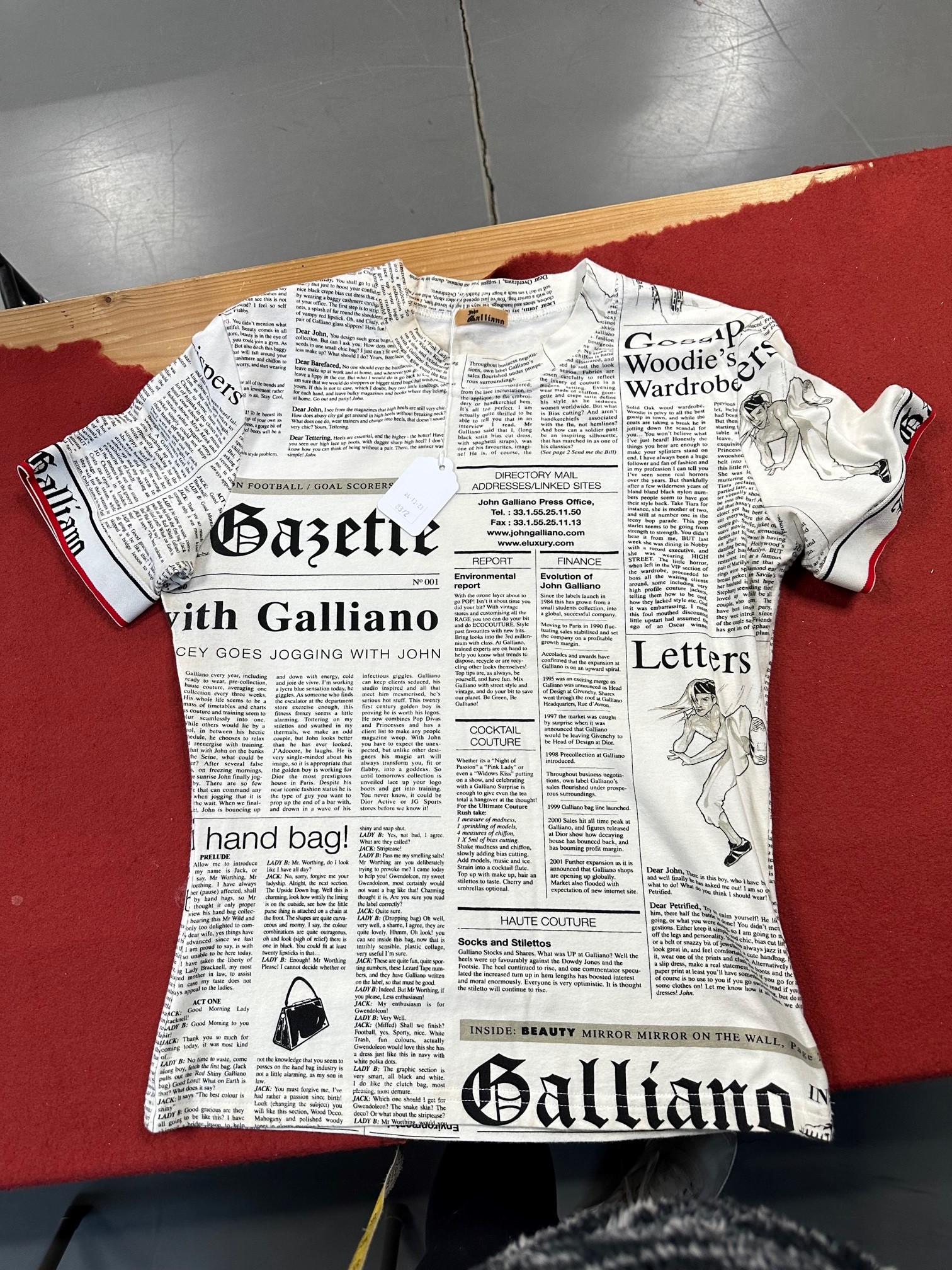 Lot 83 - A John Galliano newspaper and zebra print