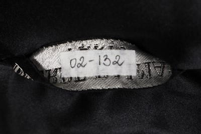 Lot 382 - A Pierre Balmain couture black bouclé wool dress, late 1950s-early 1960s
