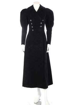 Lot 361 - An Yves Saint Laurent black ribbed velvet double-breasted coat, Autumn-Winter 1970-71