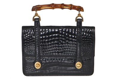 Lot 43 - A Gucci black crocodile handbag, 1960s