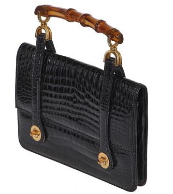 Lot 43 - A Gucci black crocodile handbag, 1960s