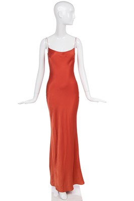 Lot 120 - A John Galliano bias-cut terracotta satin-backed crêpe evening gown, 'Ballets Russes', Spring-Summer 1999-2000