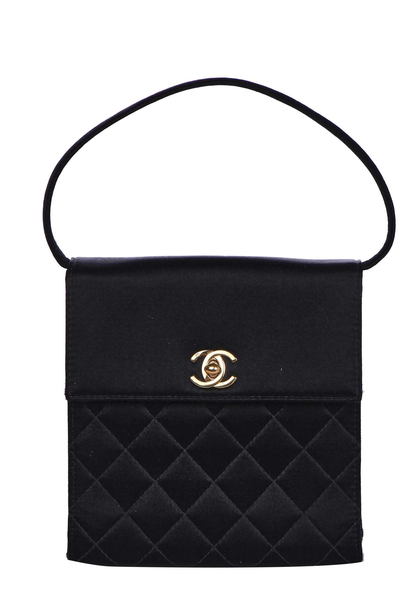Lot 169 - A Chanel quilted black satin evening bag, 2000-2002