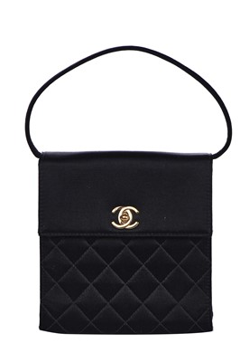 Lot 169 - A Chanel quilted black satin evening bag, 2000-2002
