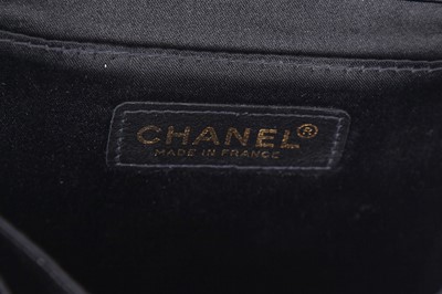 Lot 169 - A Chanel quilted black satin evening bag, 2000-2002