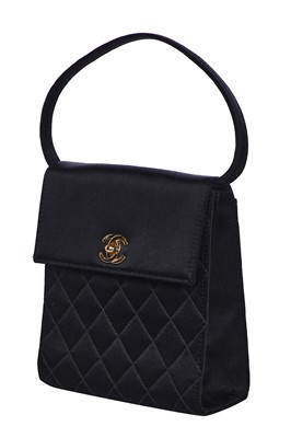 Lot 169 - A Chanel quilted black satin evening bag, 2000-2002