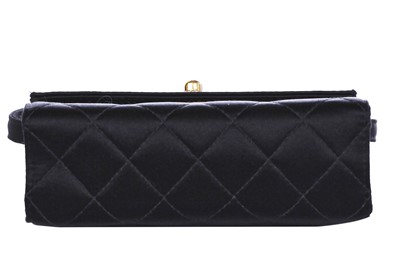Lot 169 - A Chanel quilted black satin evening bag, 2000-2002