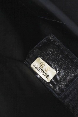 Lot 169 - A Chanel quilted black satin evening bag, 2000-2002