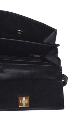 Lot 169 - A Chanel quilted black satin evening bag, 2000-2002