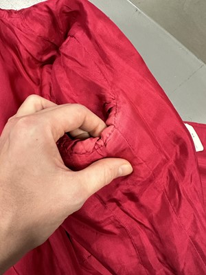 Lot 35 - A Chanel couture raspberry-pink tweed suit, circa 1960