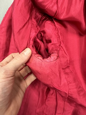 Lot 35 - A Chanel couture raspberry-pink tweed suit, circa 1960