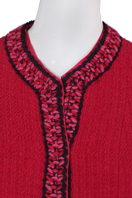 Lot 35 - A Chanel couture raspberry-pink tweed suit, circa 1960