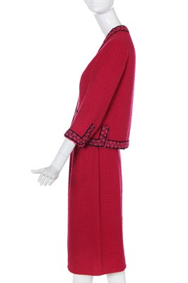Lot 35 - A Chanel couture raspberry-pink tweed suit, circa 1960