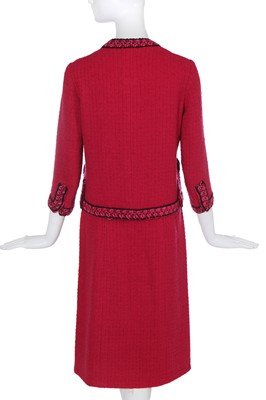 Lot 35 - A Chanel couture raspberry-pink tweed suit, circa 1960