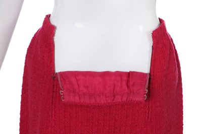 Lot 35 - A Chanel couture raspberry-pink tweed suit, circa 1960