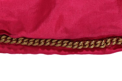 Lot 35 - A Chanel couture raspberry-pink tweed suit, circa 1960