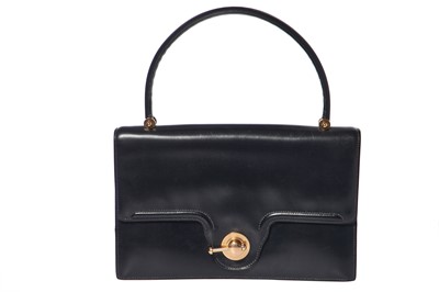 Lot 56 - An Hermès navy leather bag, 1959