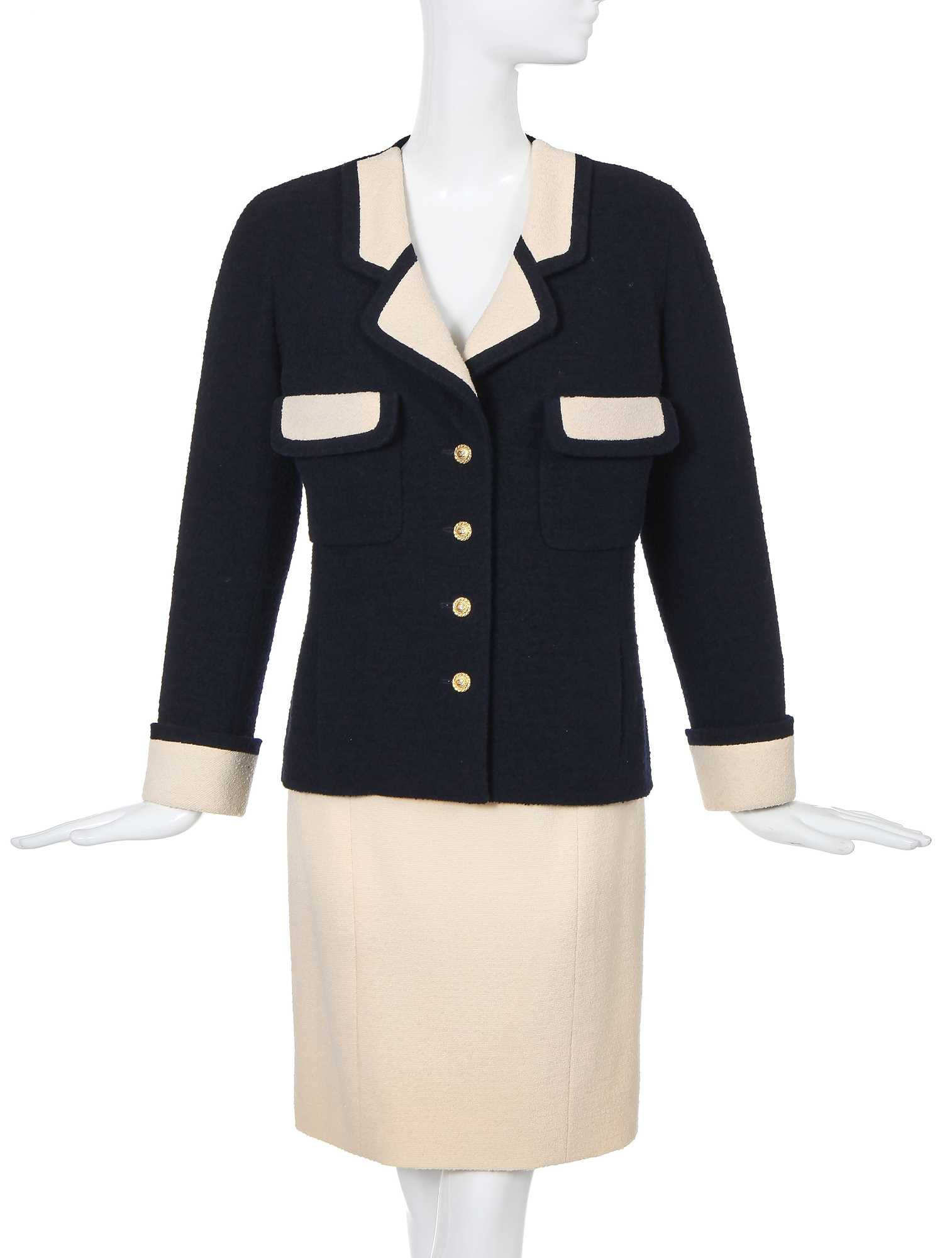 Lot 10 - A  Chanel navy and ivory bouclé wool suit, Spring-Summer 1991