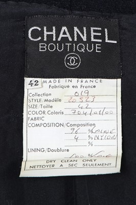 Lot 10 - A  Chanel navy and ivory bouclé wool suit, Spring-Summer 1991