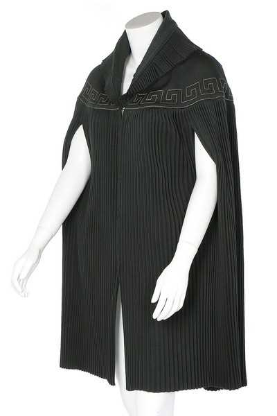 Lot 187 - A Lucien Lelong couture pleated green wool...