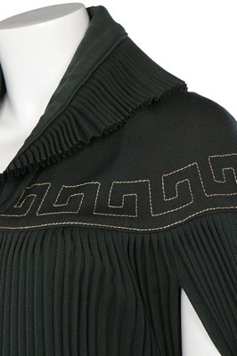 Lot 187 - A Lucien Lelong couture pleated green wool...
