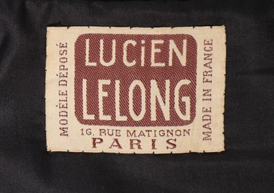 Lot 187 - A Lucien Lelong couture pleated green wool...