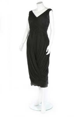 Lot 203 - A Norman Hartnell couture draped black jersey...