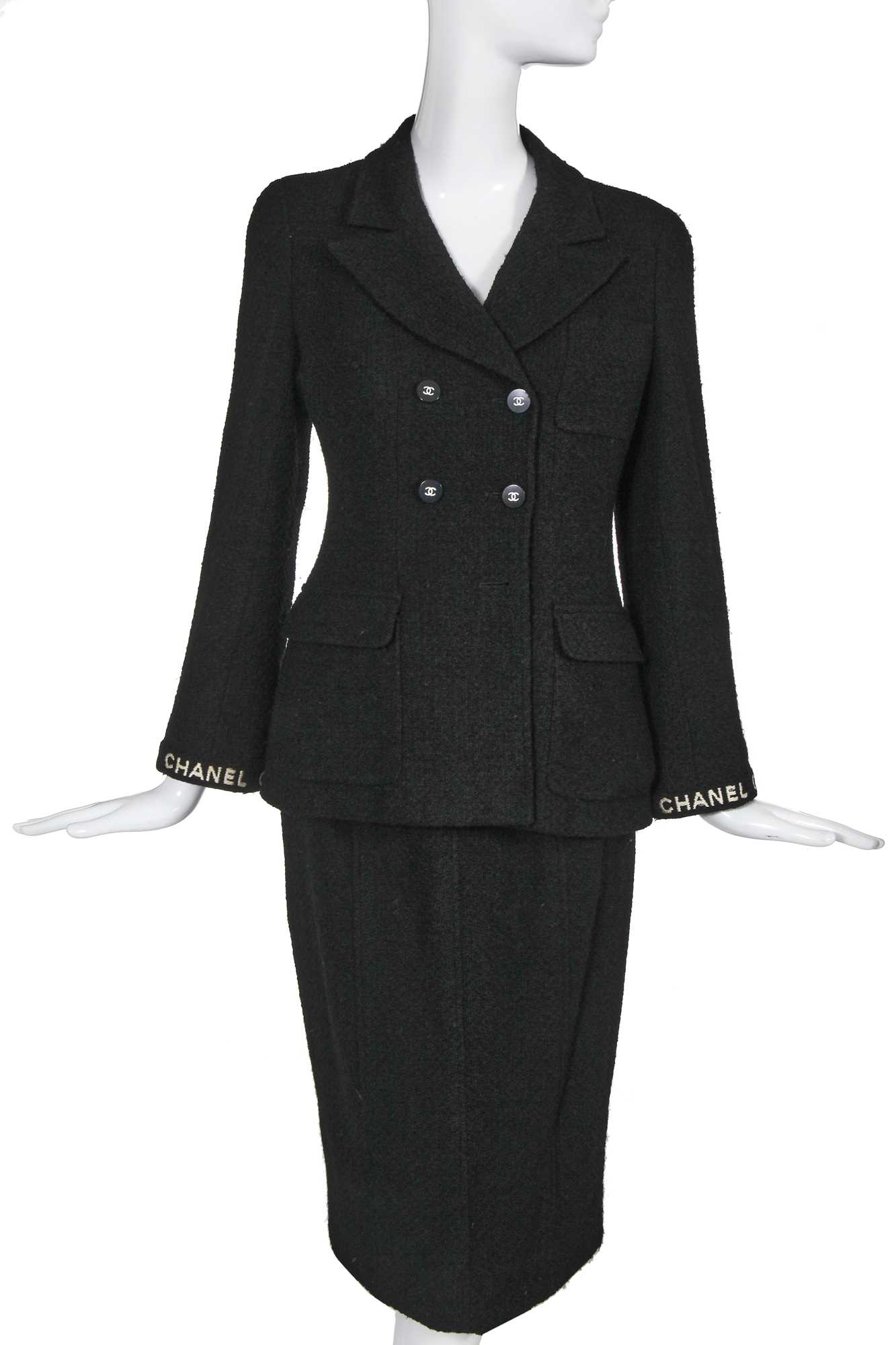 Lot 24 - A Chanel black bouclé wool suit, Autumn-Winter 1995-96