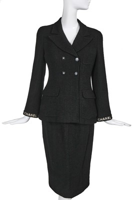 Lot 24 - A Chanel black bouclé wool suit, Autumn-Winter 1995-96