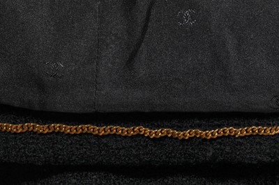 Lot 24 - A Chanel black bouclé wool suit, Autumn-Winter 1995-96