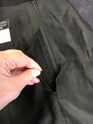 Lot 24 - A Chanel black bouclé wool suit, Autumn-Winter 1995-96