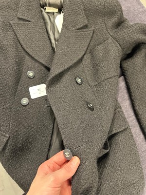 Lot 24 - A Chanel black bouclé wool suit, Autumn-Winter 1995-96
