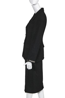 Lot 24 - A Chanel black bouclé wool suit, Autumn-Winter 1995-96
