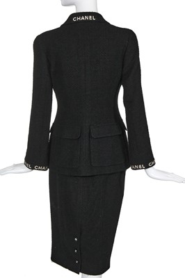 Lot 24 - A Chanel black bouclé wool suit, Autumn-Winter 1995-96