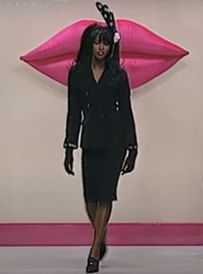 Lot 24 - A Chanel black bouclé wool suit, Autumn-Winter 1995-96