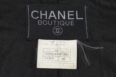 Lot 24 - A Chanel black bouclé wool suit, Autumn-Winter 1995-96